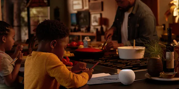 Boy listening to HomePod